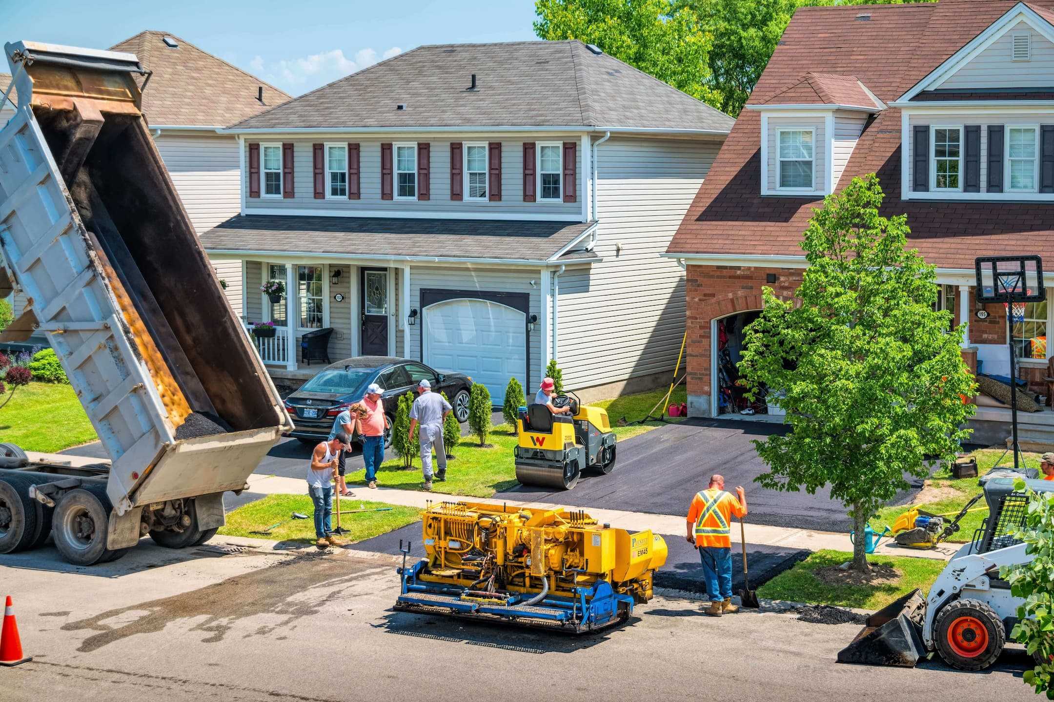 Loader dropping new asphalt